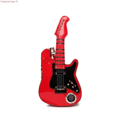 Electric guitar-shaped ROCK OUT crossbody pocketbook with a built-in USB speaker and SD card player